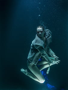 woman dancing under the sea
