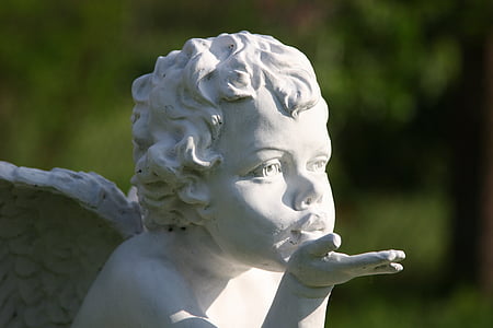 cherub doing flying kiss statue