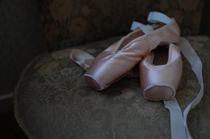 pair of pink pointe shoes