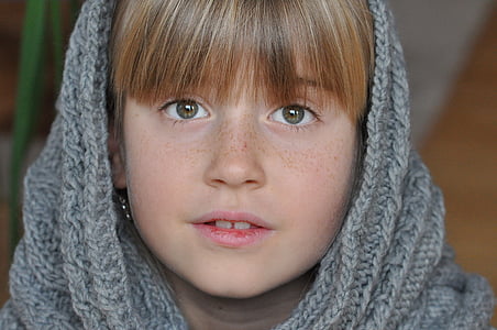 close-up photo of girl wearing gray cable knit hijab veil