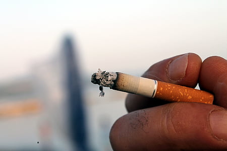 person holding a cigarette