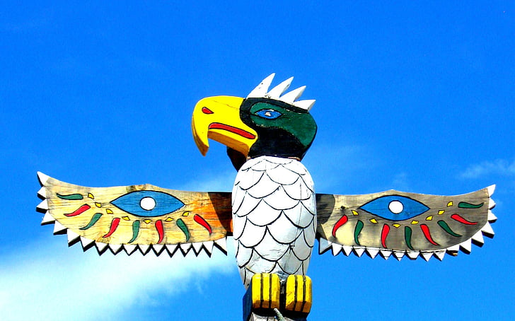 multicolored wooden eagle totem statue