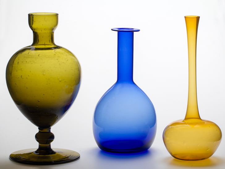 yellow, blue, and green glass vases