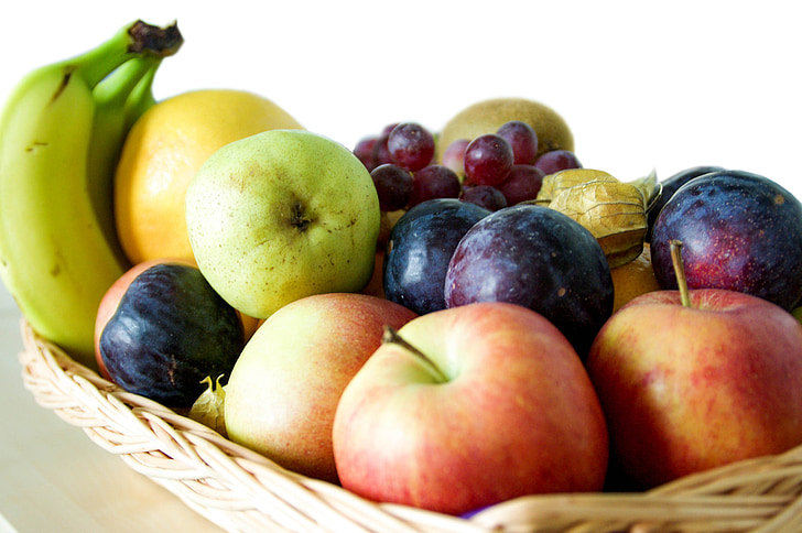assorted fruits on beige wicker basket