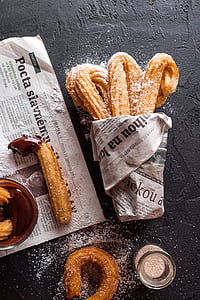 baked bread food coated with newspaper