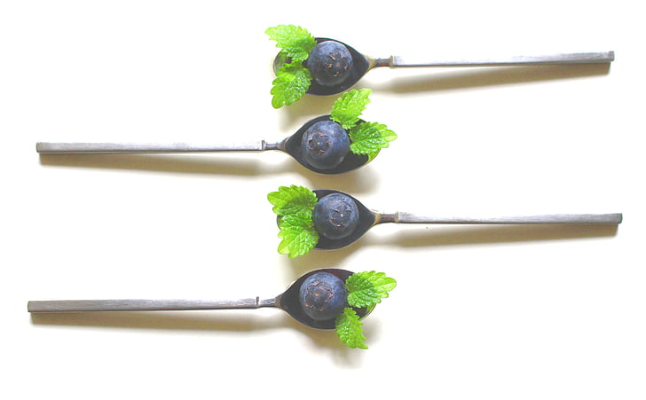 stainless steel spoon with grapes
