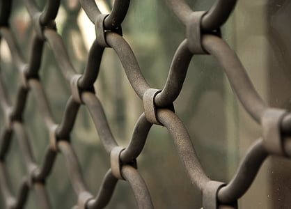 close up photography of gray cyclone fence
