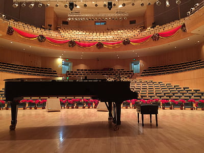 black grand piano on stage