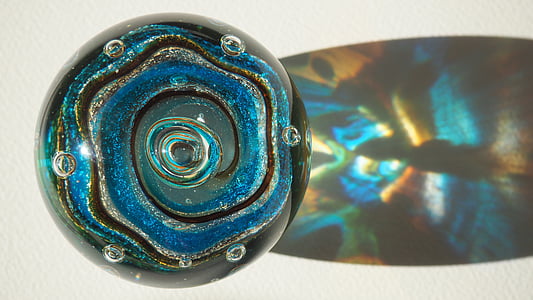 black, brown, and blue marble toy