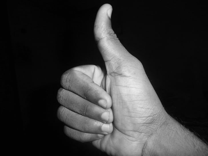 grayscale photo of okay hand gesture