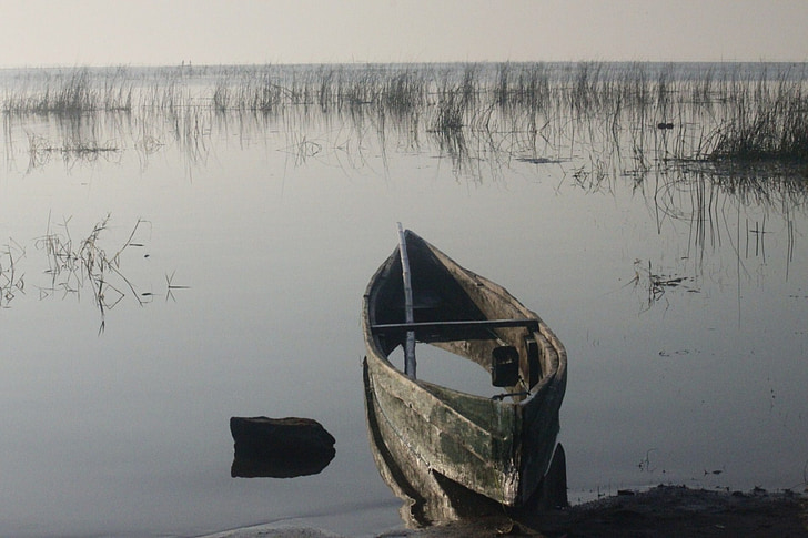 gray boat on lake