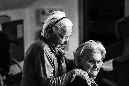 grayscale photography of two woman