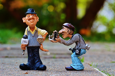 shallow focus photography of two men plastic toys