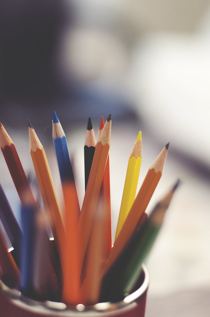 selective focus photography of color pencils