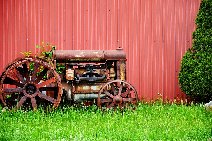 brown tractor on green grass