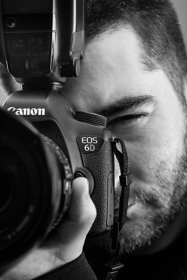 grayscale photo of a man using Canon EOS 6D