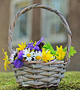 selective focus photo of flowers on basket