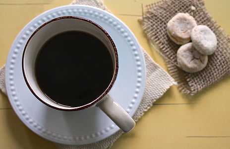white and brown coffee mug with suacer