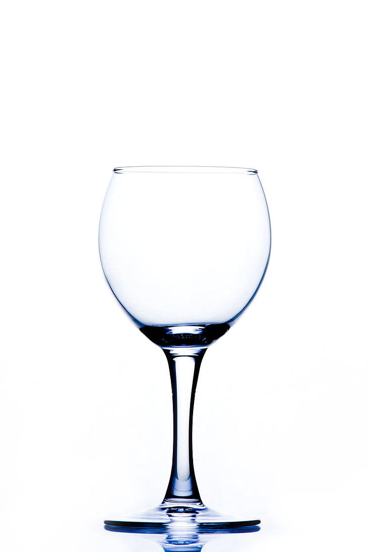 Clear drinking glass with brown liquid on white paper photo – Free