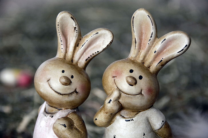 two white rabbit figurines