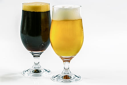 two clear footed drinking glasses