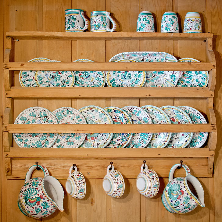 brown wooden floating dinnerware shelf with blue floral ceramic dinnerwares