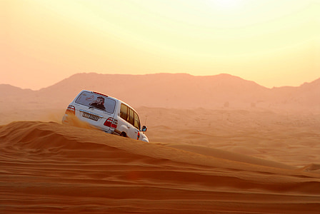 white vehicle on desert