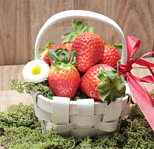 six strawberries on white woven basket