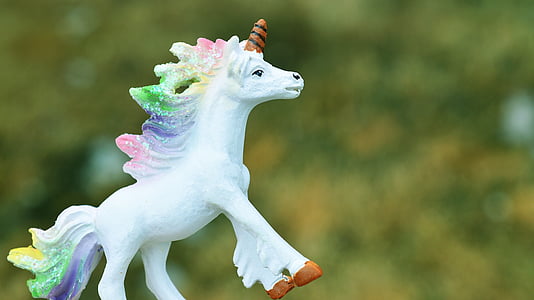 shallow focus photography of unicorn figurine