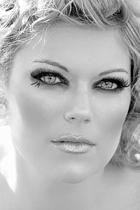 greyscale photography of woman's face wearing make up