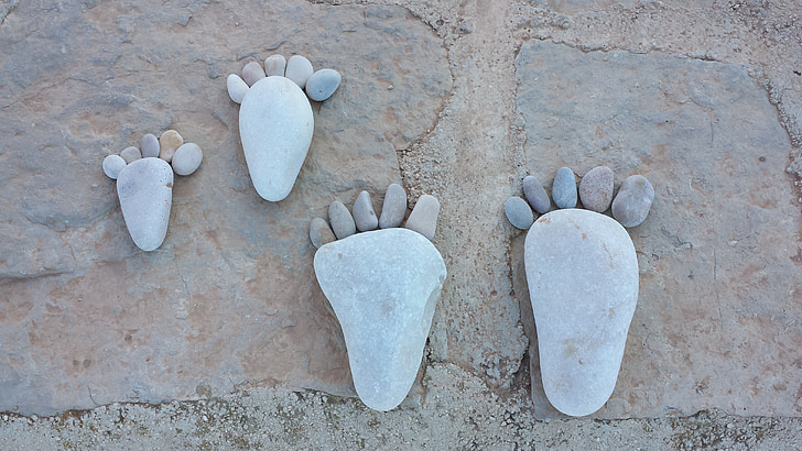 two pairs of feet stone formations