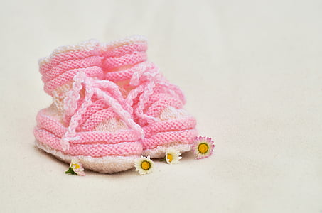 toddler's pair of pink bootees
