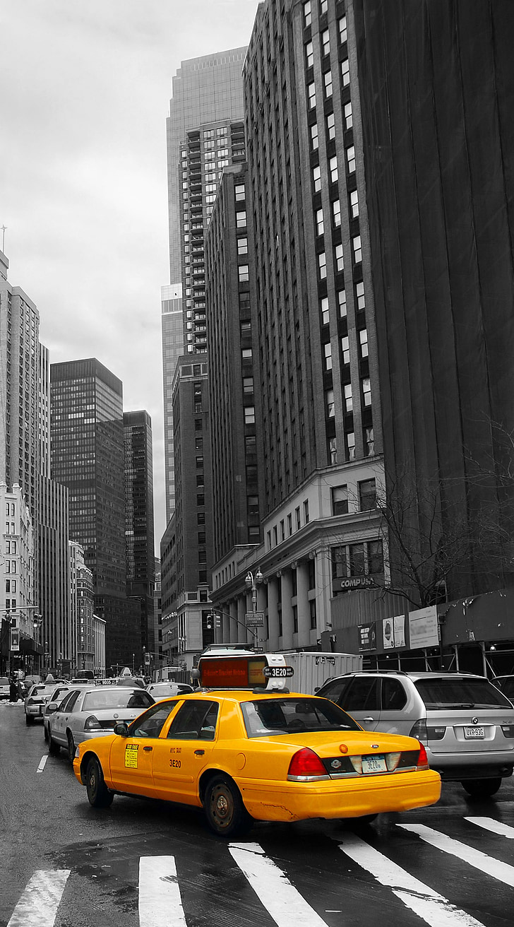 selective color photography of yellow Ford Crown Victoria sedan