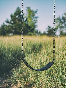selective focus photography of swing