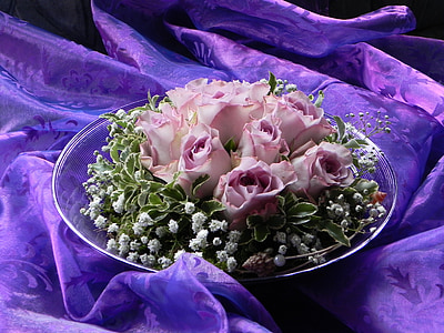 pink roses on top of clear glass bowl