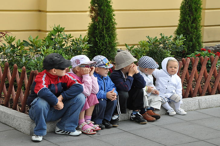 group of children sitting on floor at during time