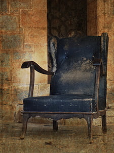 brown wooden framed blue padded armchair