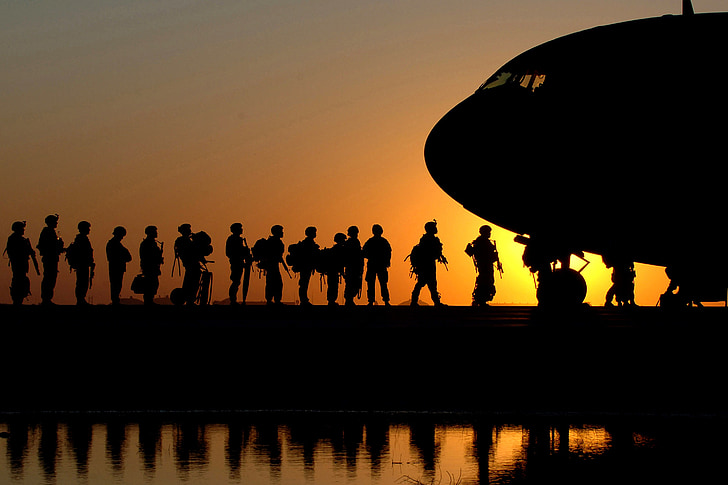 silhouette photo of soldiers