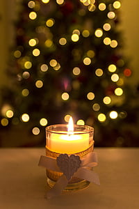 lighted votive candle with bokeh lights