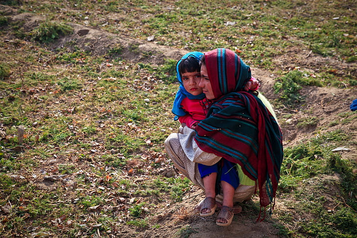 female carrying child