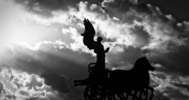 silhouette of angel riding carriage