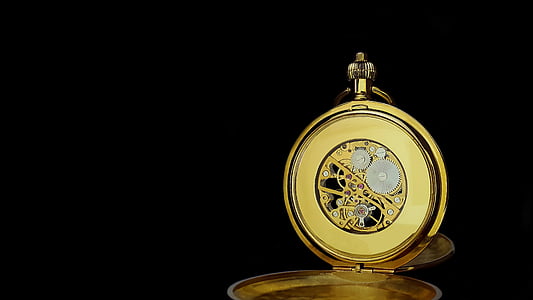round gold-colored pocket watch