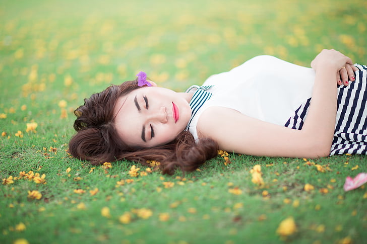 woman lying on lawn