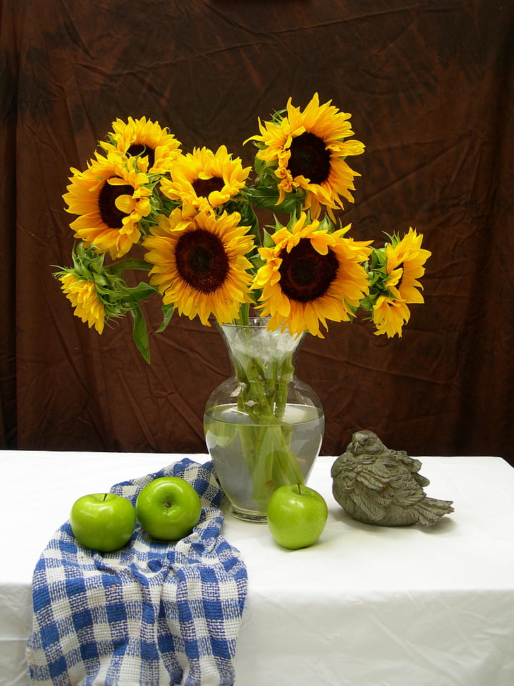 sunflowers in clear glass vase