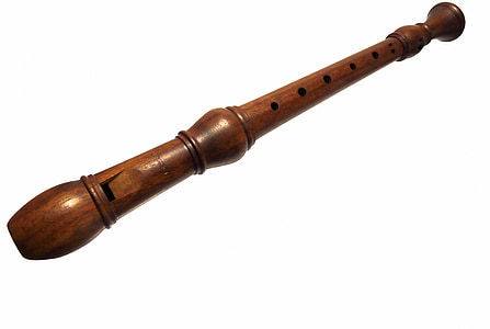 brown wooden recorder with white background