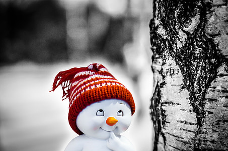 snowman wearing red knit hat illustration