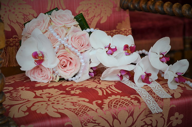 bouquet of pink roses on top of armchair
