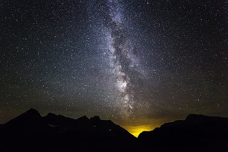 photography of silhouette mountain under the night sky
