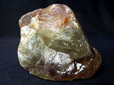 green and brown gemstone