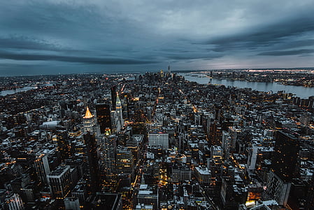 aerial photography of city under white sky during night time